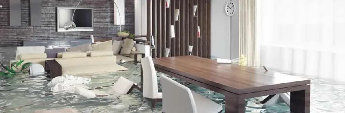 home interior affected by water damage with flooded floors and displaced furniture in Cincinnati, OH